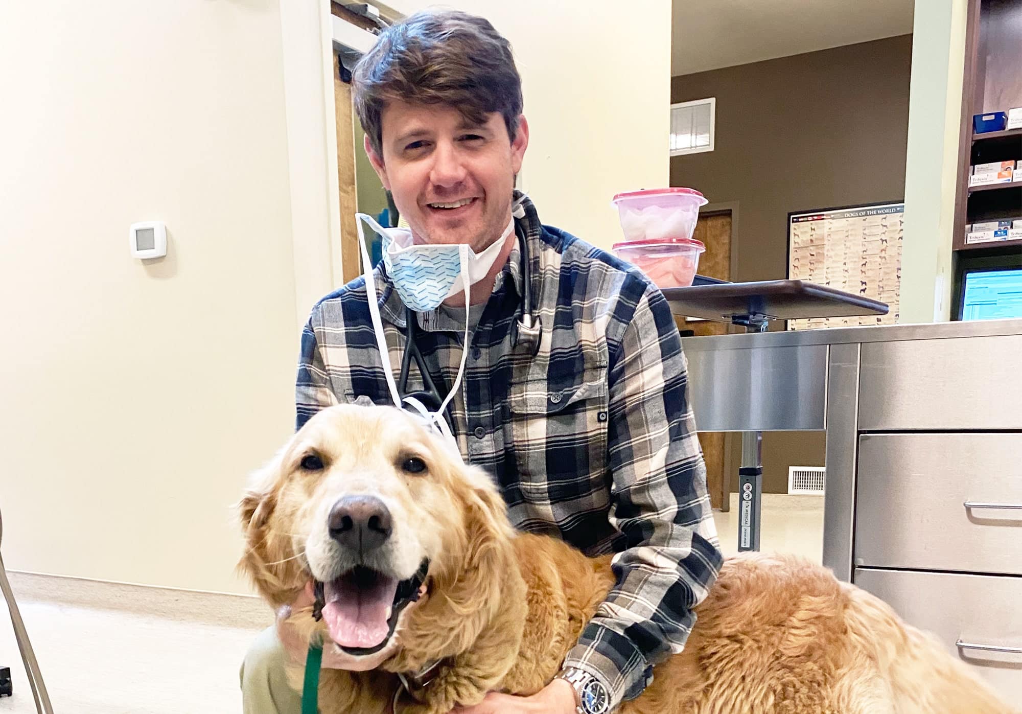 dr jackson walker with a golden retreiver at walker canine care