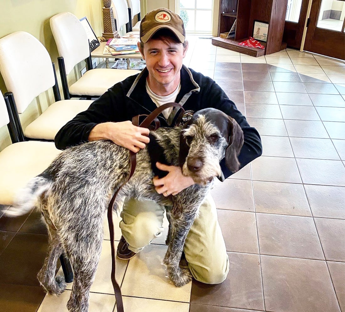 dr jackson walker with a dog in Walker Canine Care